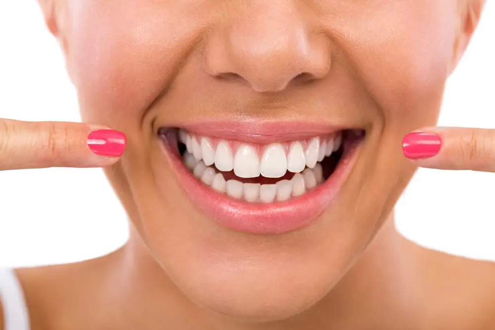 Smiling woman showing her perfect white teeth